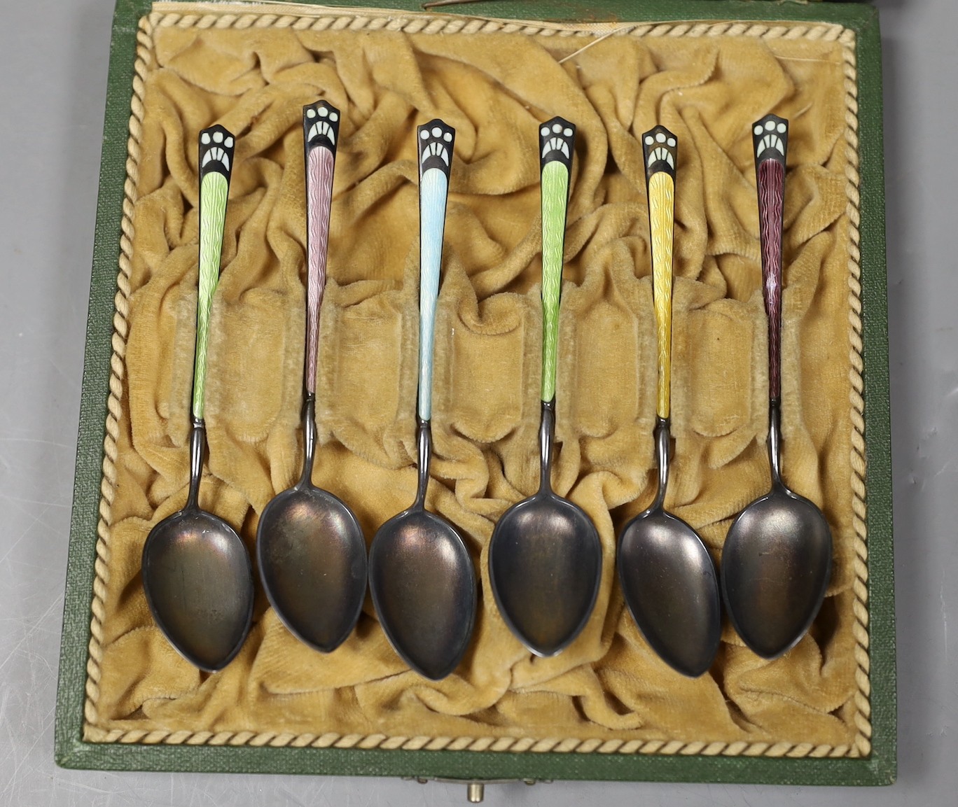 A cased set of six Norwegian sterling and polychrome enamel coffee spoons by Marius Hammer, 94mm